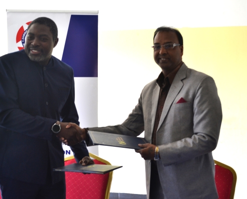 ZUNMO President Fray Michelo (left) with TAU Z Vice Chancellor Prof. (Dr.) Ajay Kumar Poddar during the signing ceremony at ZUNMO Headquarters in Lusaka.